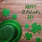Happy Saint Patrick`s Day greeting card with traditional symbols, shamrock, green attire. Green hat, bow tie, St