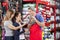 Happy Salesman Showing Rabbit To Family In Store