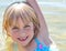 Happy, Sandy Little Girl in the Lake