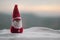 Happy Santa Claus Doll on Christmas time with tree and snow. Blurred outdoor background. Santa Clause and Merry Christmas model fi