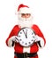 Happy Santa in eyeglasses pointing at clock showing five minutes