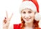 Happy santa helper showing victory sign