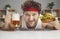 Happy satisfied man enjoy eating hamburger drinking beer closeup face portrait