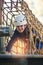 Happy school girl enjoying activity in a climbing adventure park