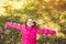 Happy school girl throws the autumn leaves in the air. Instagram