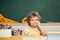 Happy school kids at lesson. Chalkboard copy space. Little ready to study. Portrait of Pupil in classroom.