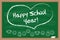 Happy school year. Chalk drawn heart. Inscription on the green blackboard.