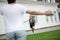 Happy schoolgirl running from school to meeting mom