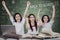 Happy schoolgirls celebrate back to school