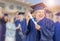 Happy Senior Adult Woman In Cap and Gown At Outdoor Graduation C