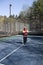 Happy senior athlete platform tennis paddle court