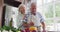 Happy senior caucasian couple at home in the kitchen