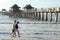 Happy senior couple enjoys a romantic stroll on the beach