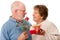 Happy Senior Couple with Gift and Red Rose