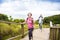 Happy senior couple hiking on the mountain park