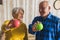 happy senior couple holding apples healthy lifestyle concept medium closeup living room