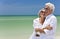 Happy Senior Couple Looking To Sea on Beach