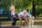 Happy Senior couple outdoors with dog enjoying