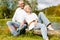 Happy senior couple outdoors in spring