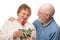 Happy Senior Couple with Red Rose