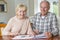 Happy Senior Couple Reviewing Domestic Finances Together