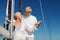 Happy senior couple on sail boat or yacht in sea