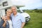 Happy senior couple sightseeing basque country with camping car