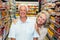 Happy senior couple at the supermarket