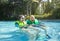 Happy Senior couple swimming together on a lazy river