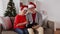 Happy senior couple with tablet pc at christmas