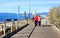 Happy senior couple walking along the coast the mediteranea sea