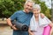 Happy senior couple with yoga mat