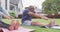 Happy senior diverse couple practicing yoga in garden