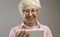 Happy senior lady using a digital tablet
