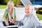 Happy Senior Man Playing Rummy With Woman