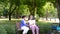 Happy senior mother with gray hair talk and laugh with daughter or caregiver in the park. Concept of happy retirement with care