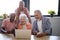 Happy senior people using technology at nursing home