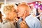 Happy senior retired couple having fun on dancing at restaurant