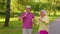 Happy senior stylish couple family grandmother grandfather enjoying date, dancing in summer park