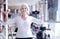 Happy senior woman exercising with dumbbells