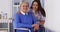 Happy senior woman with friendly Mexican caregiver