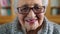 Happy senior woman, smile and wisdom with glasses against a blurred background in a library. Portrait of a elderly