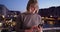 Happy senior woman texting on mobile device in Venice, Italy