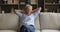 Happy serene senior elder woman resting on home couch