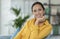 Happy serene woman posing at home