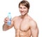 Happy shirtless sportsman holds water.