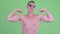 Happy shirtless young man flexing both arms