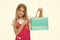 Happy shopaholic girl. Child buy modern items on sale. Girl smiling happy face pointing shopping bag, isolated white