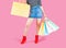 Happy shopping!Female in red shoes holding multicolored shopping bags  on pink background