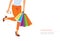 Happy shopping! Unrecognizable woman in orange pants holding multicolored shopping bags
